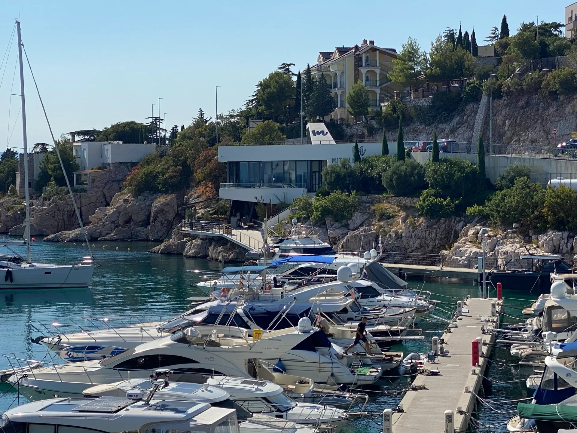 Mitan Marina piers with the cafe terrace on the hillside