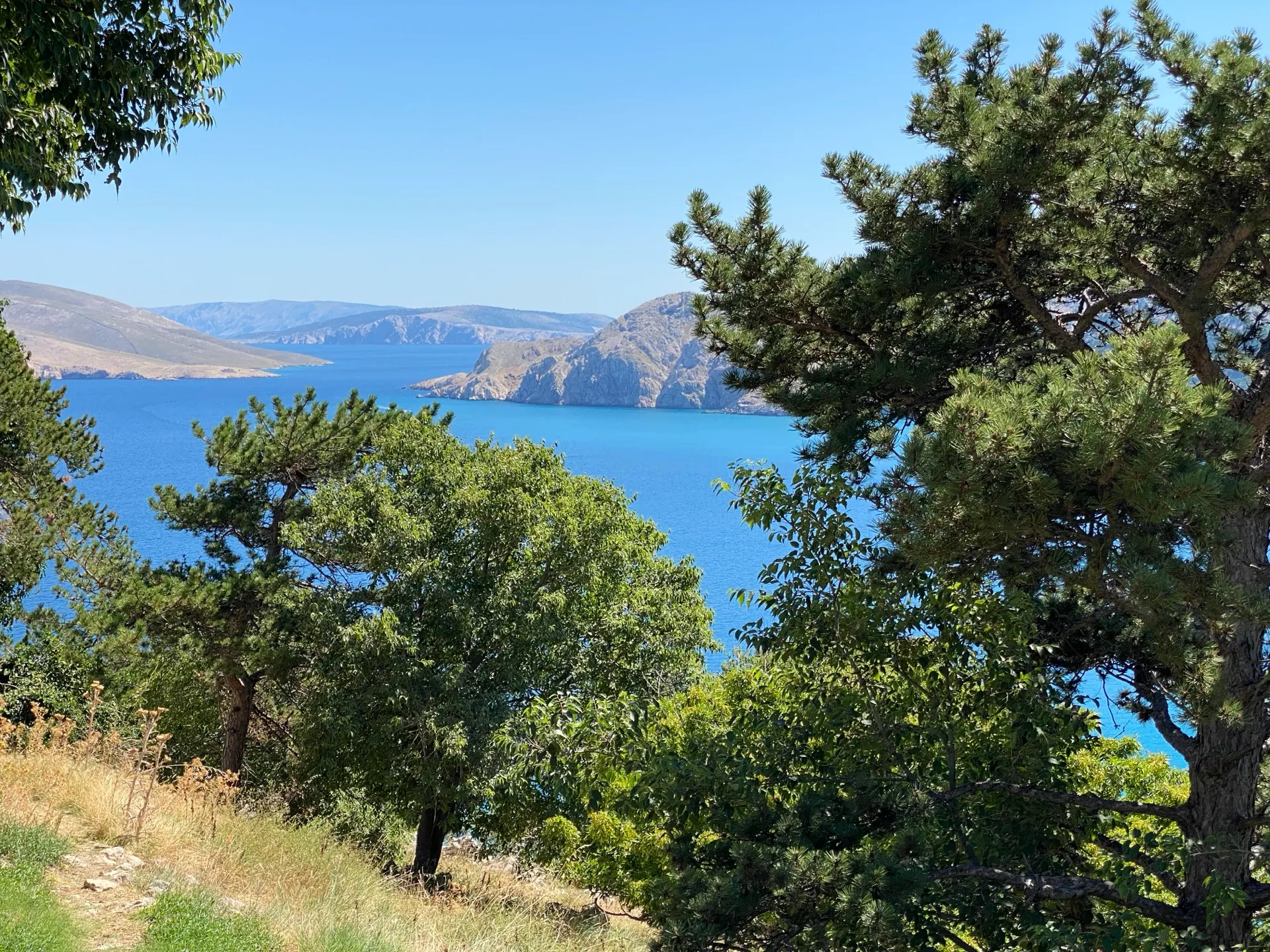 Rocky karst coastline and blue sea near Baška on Krk Island