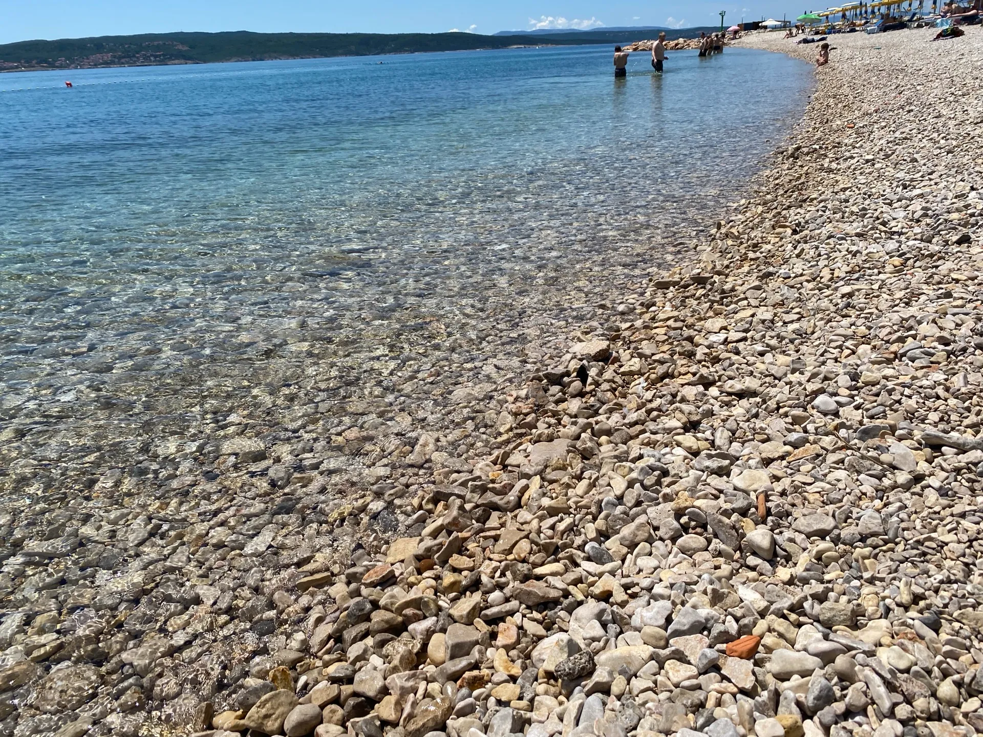 Pebble water entry on a beach in Crikvenica