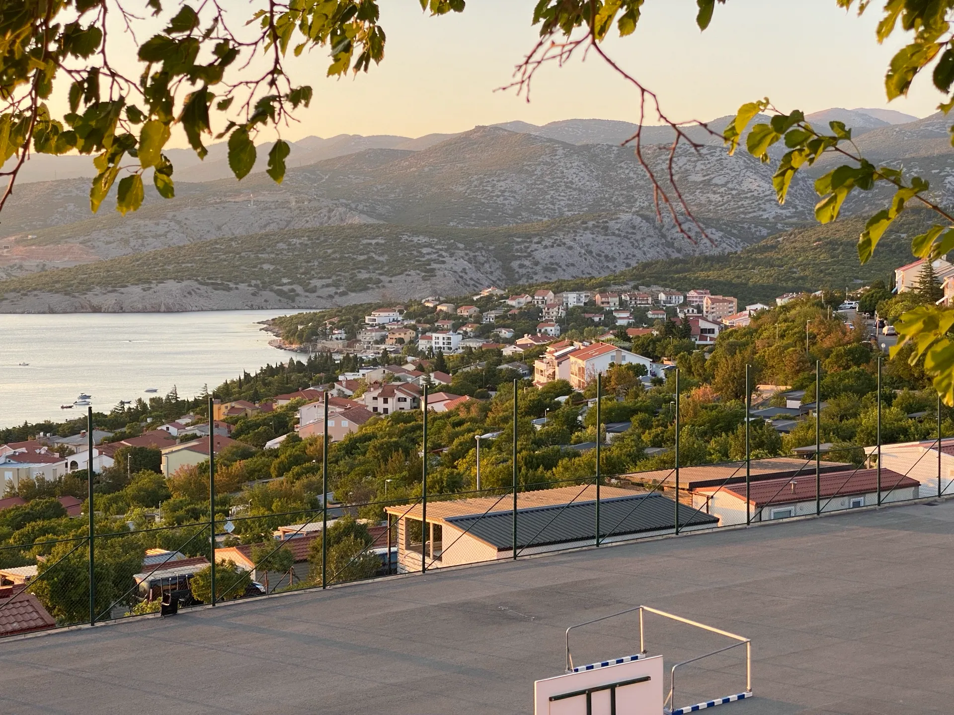 Klenovica fishing village on the hillside at golden hour
