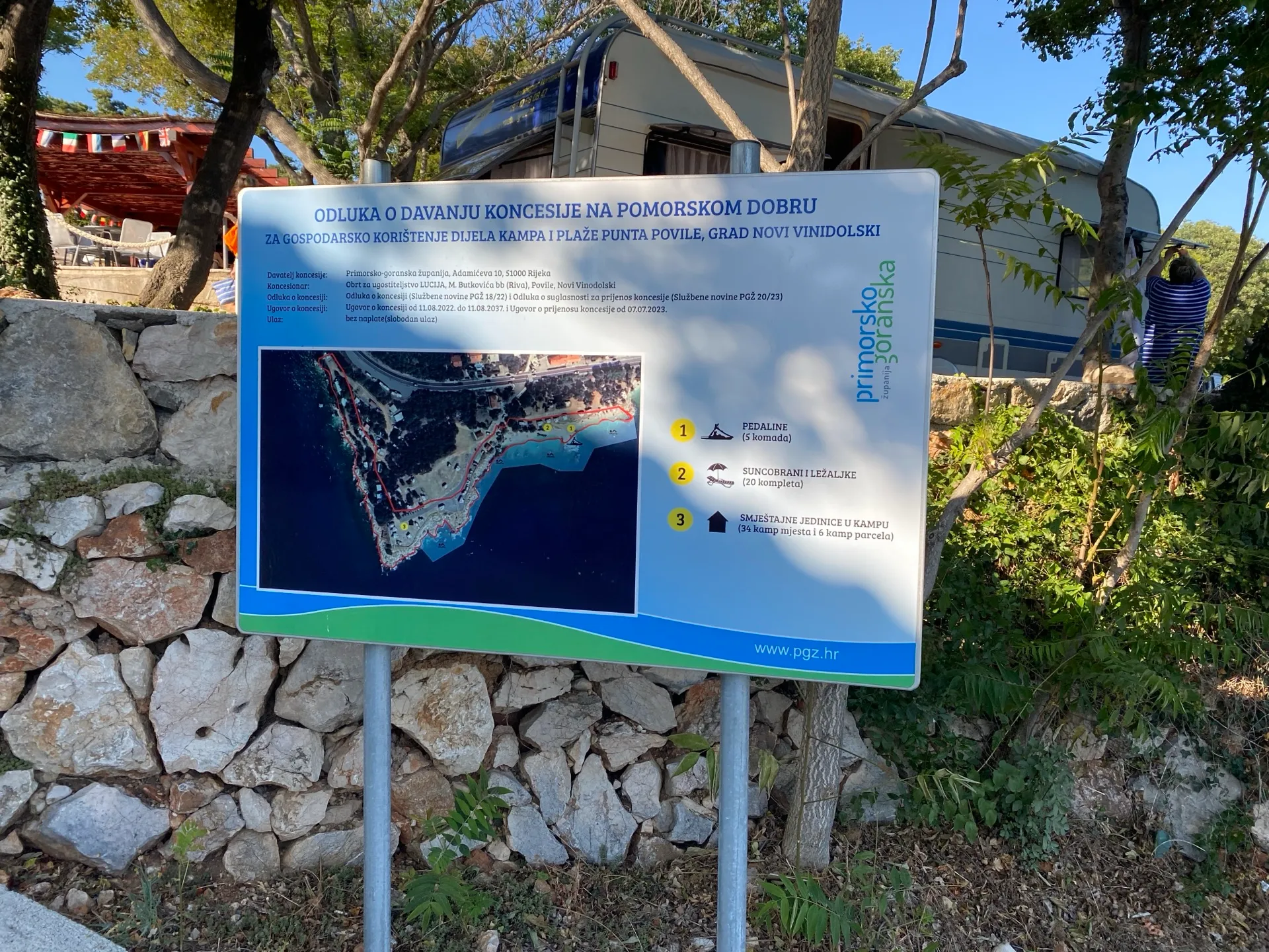 Beach concession information sign in Povile in 2026