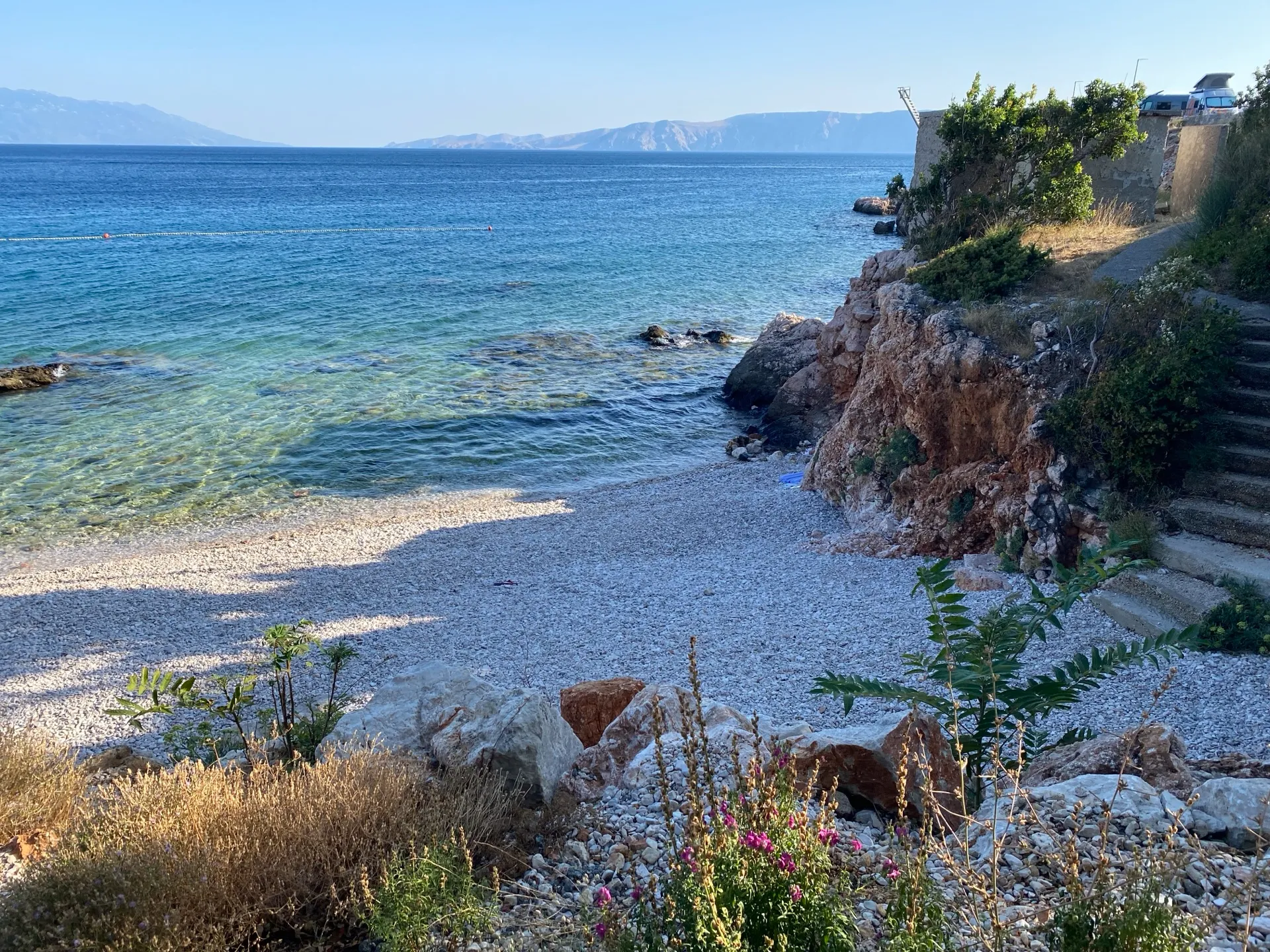 Small pebble cove and rocky coast in Povile, Croatia
