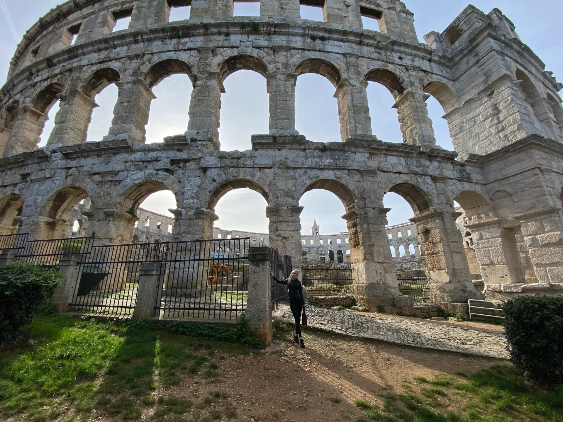 Monumental stone arches of Pula Arena seen from inside