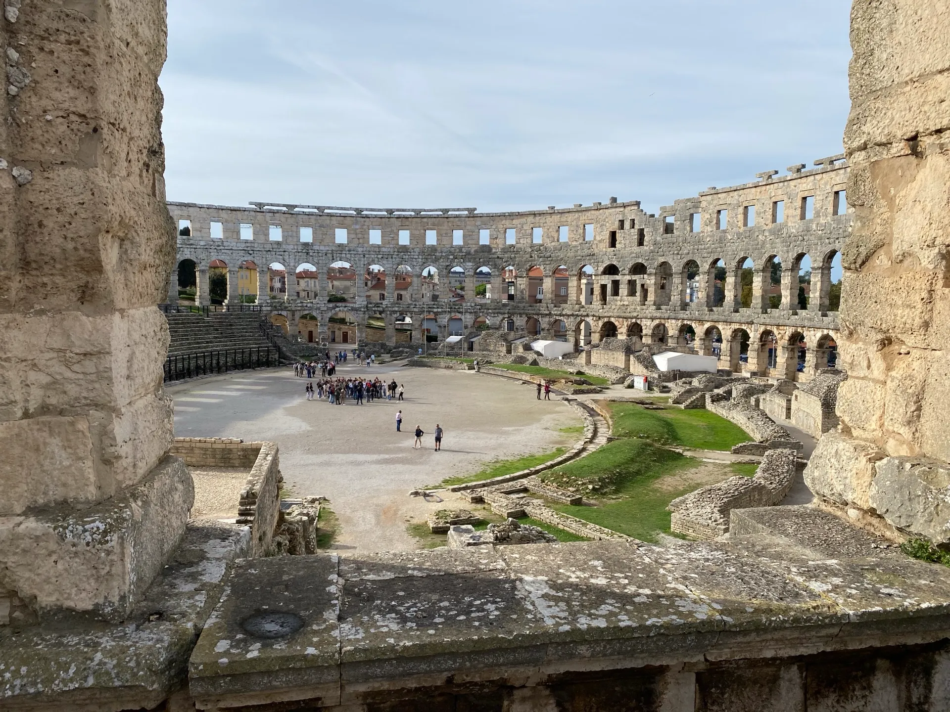 Arena floor and preserved outer wall inside Pula Amphitheatre