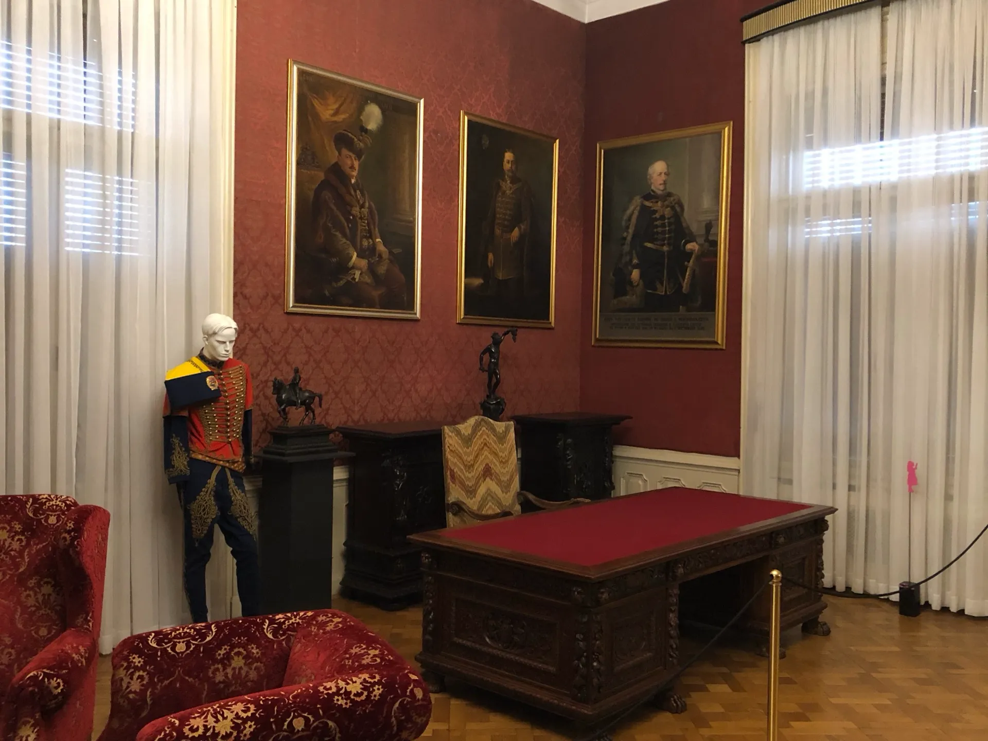 Historic salon with portraits and furniture in Rijeka's maritime museum