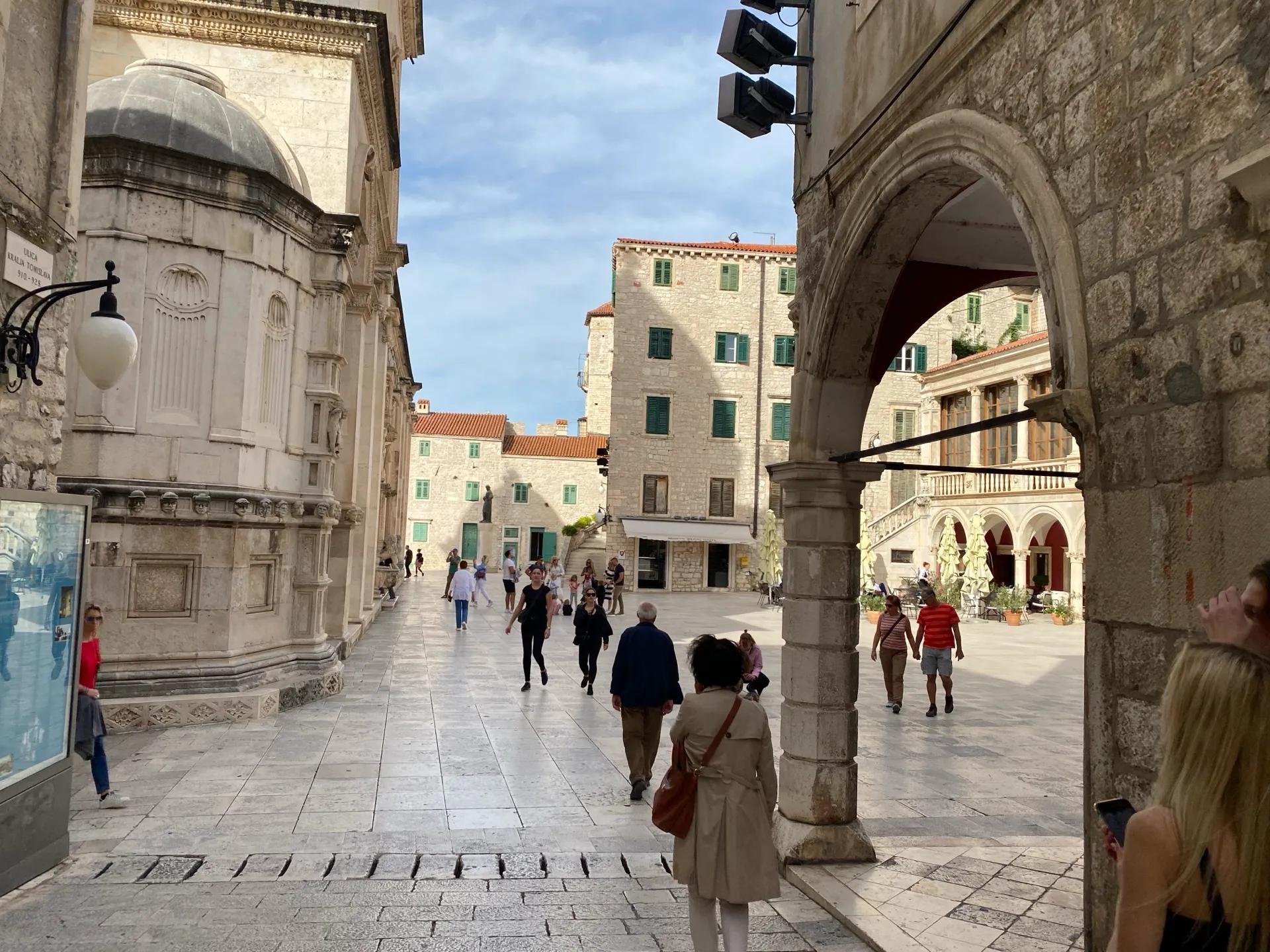 Stone arch opening onto the square beside the Cathedral of St James in Šibenik