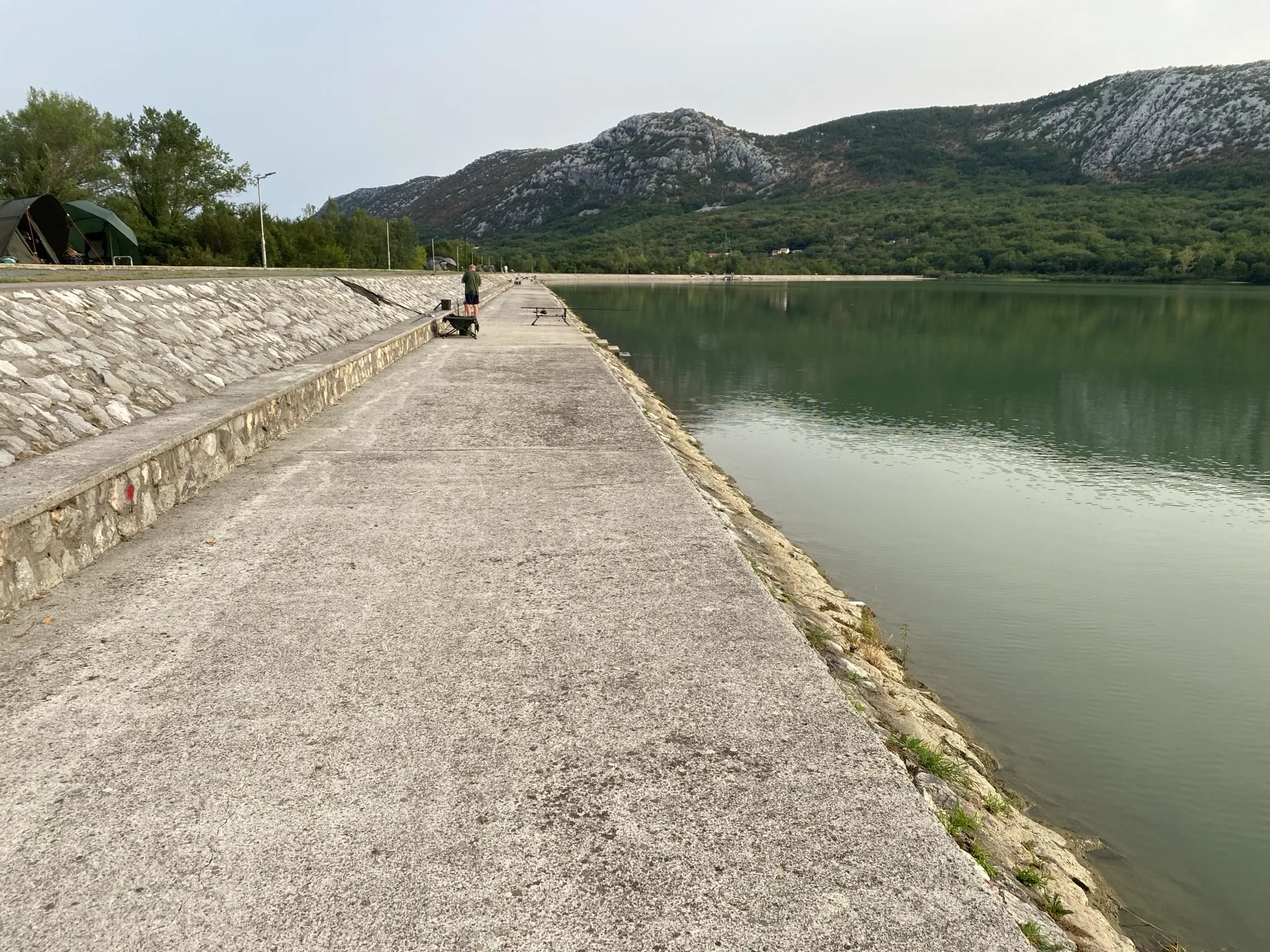 Lakeside walkway and fishing places at Lake Tribalj